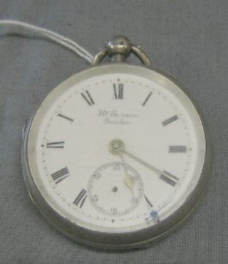 An open faced pocket watch by J W Benson The English Lever watch contained in a silver case