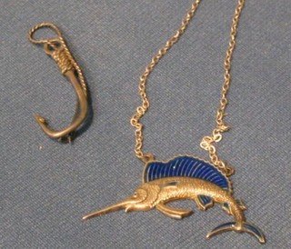 A "silver" brooch in the form of a fishing hook and a "silver" and enamelled pendant in the form of a sword fish hung on a chain