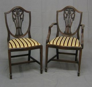 A set of 6 Hepplewhite style shield back dining chairs with upholstered drop in seats, raised on square tapering supports