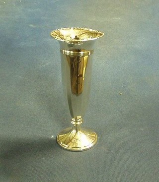 A waisted silver vase, raised on a circular spreading foot, 5" (marks rubbed)