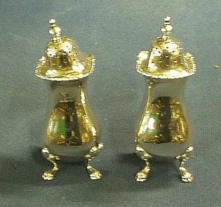 A pair of Georgian style silver pepperettes London 1917 by the Goldsmiths & Silversmiths Co.