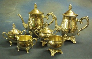 A modern silver plated 3 piece tea service of baluster form and 1 other
