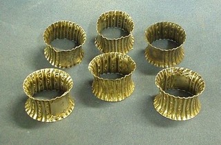 A set of 6 waisted and embossed silver napkin rings, Birmingham 1900, 4 ozs