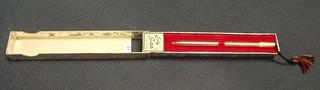 A Scuptos pen contained in a gilt metal case