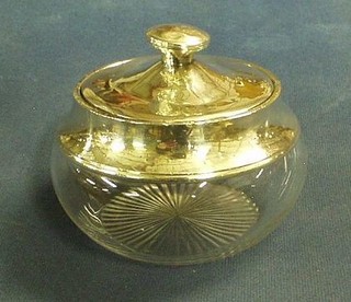 A circular cut glass powder bowl with silver lid 4"