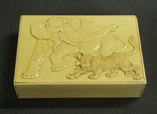 A carved ivory trinket box the lid decorated an elephant and lion 6 1/2"
