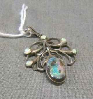 A silver pendant set opal coloured stones