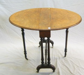 A Victorian oval figured walnutwood Sutherland table, raised on turned supports, 30"