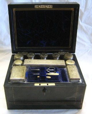 A  19th Century coromandel vanity box with hinged lid, the interior fitted 3 cut glass pin jars with silver plated lids and 7 other bottles 12"