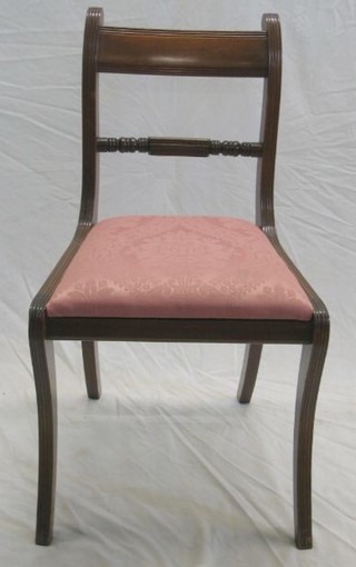 A set of 6 Georgian style mahogany bar back dining chairs with turned mid rails and upholstered drop in seats, raised on sabre supports