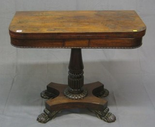 A William IV rosewood card table, raised on carved turned column and triform base with pole feet 36"