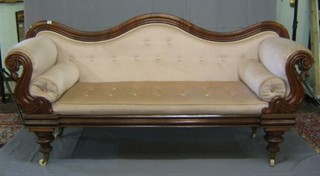 A Regency mahogany show frame sofa upholstered in light material, raised on turned supports 82"