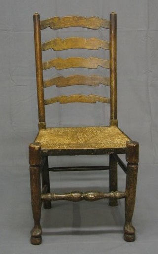 A harlequin set of 12 elm Lancashire ladder back dining chairs with woven rush seats on club supports