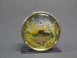 A Westclox childs alarm clock with minute indicator in the form of 2 Pixies on a seesaw