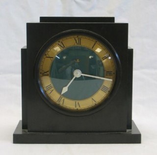 A 1930's electric mantel clock by Temco contained in a green Bakelite case with gilt chapter ring and Roman numerals