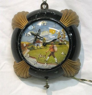 A 1950's English electric wall clock decorated a windmill and a walking miller contained in a plastic case