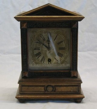 A 19th Century Continental 8 day mantel clock with silvered dial and Roman numerals contained in a mahogany case by HAC