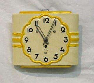 A 1950's 8 day kitchen clock by The Black Forrest Clock Co. contained in a pottery case