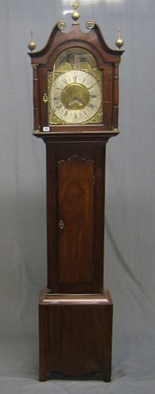 An 18th Century 8 day striking 30 hour longcase clock, the 12 1/2" arch shaped dial with phases of the moon, gilt metal spandrels, calendar aperture, silvered chapter ring, Roman numerals, striking on a bell by Thomas Lister of Halifax, contained in an associated mahogany case with broken cornice and long door, having canted corners, raised on bracket feet, 87"