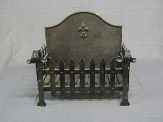 A wrought iron fire grate with integral fire back 19" x 12"