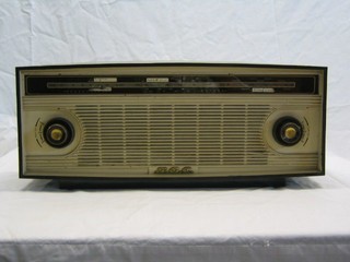 A BC402 radio contained in a brown and yellow plastic case