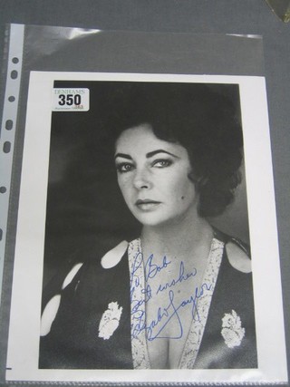 A black and white signed portrait photograph of Elizabeth Taylor inscribed To Bob Best Wishes Elizabeth Taylor