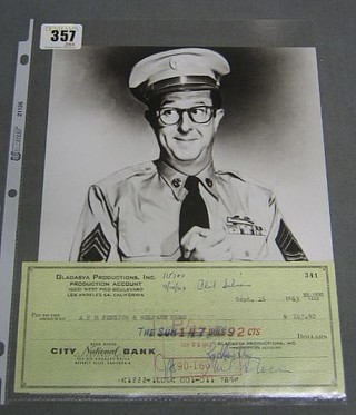 A cheque signed by Phil Silvers drawn on the Gladasya Productions account, dated Sept. 16 1963, payable to A F M Pension & Welfare Fund for $147.92 together with a black and white photograph of Sargent Bilco