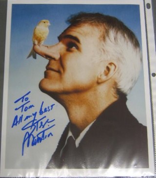 A signed colour photograph of Steve Martin inscribed "To Tom, All my best wishes Steve Martin"