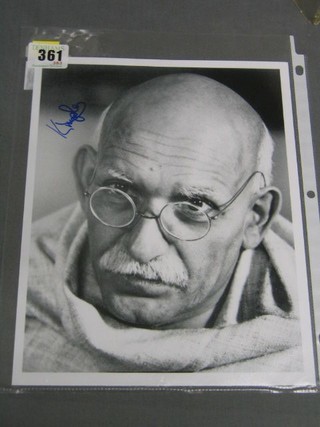 A signed black and white photograph of Ben Kingsley from the film Ghandi, signed surname only