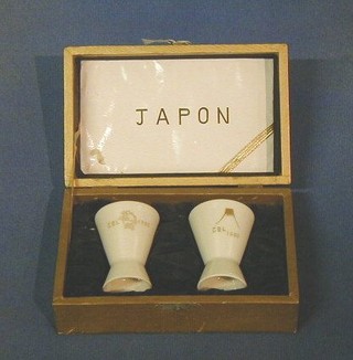 A pair of porcelain presentation sake cups