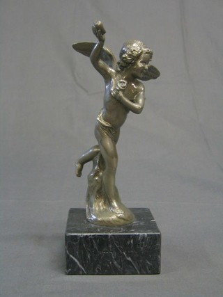 A chromium plated figure of a winged cherub marked J Dunach, raised on a square grey veined marble base 8"