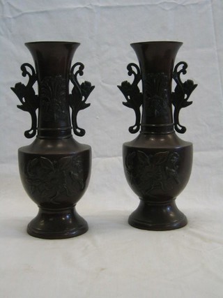 A pair of Oriental bronze twin handled urns 12"