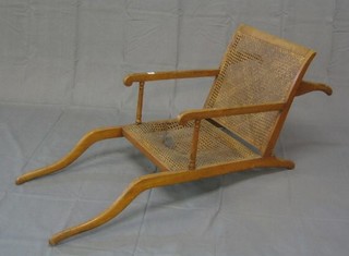 A 19th Century beech framed and woven cane, invalid's carrying chair by J Ward of Tottenham Court Road