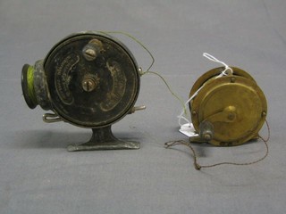 A 19th Century brass centre pin fishing reel 2" and 1 other reel