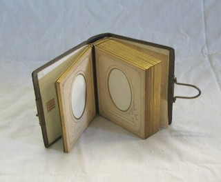 A Victorian leather bound photograph album 5" x 6"