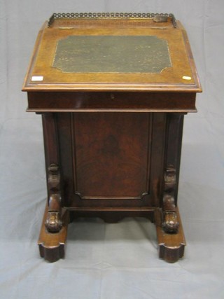 A Victorian figured walnutwood Davenport with pierced brass three-quarter gallery with inset tooled leather writing surface, the pedestal fitted an inkwell drawer and 4 long drawers enclosed by panelled cupboard, 22"