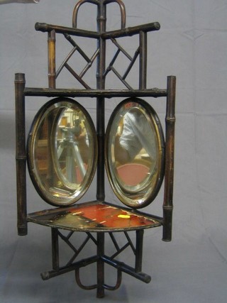 A bamboo niche with 2 oval plate mirrors 12"