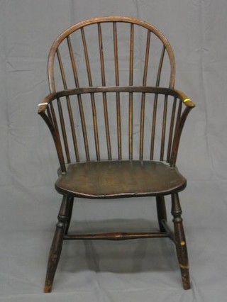 A 19th Century elm stick and bar back kitchen carver chair with solid elm seat (reduced in height)