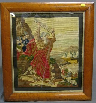 A Victorian Berlin woolwork panel "Moses Bringing the Ten Commandments Down From Mount Sinai" contained in a maple  frame 21" x 18"