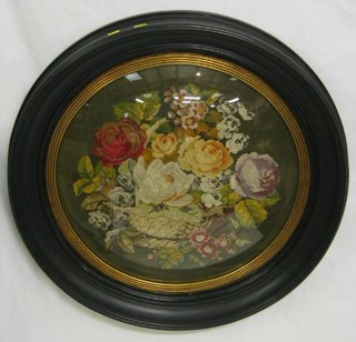 A circular Victorian Berlin panel depicting still life of flowers 21" contained in a circular oval frame