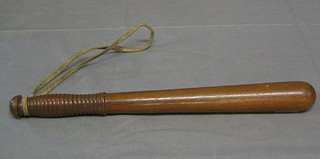 A turned wooden truncheon