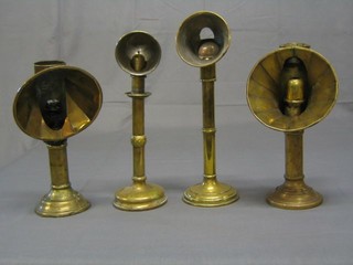 4 19th Century angled candlesticks and 1 other
