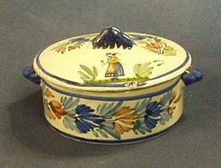 A circular twin handled Quimper butter dish and cover, the lid decorated a lady, the base and lid marked Henriot Quimper France 4"