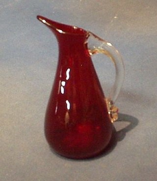 A Whitefriars red glass jug with clear glass handle 6"