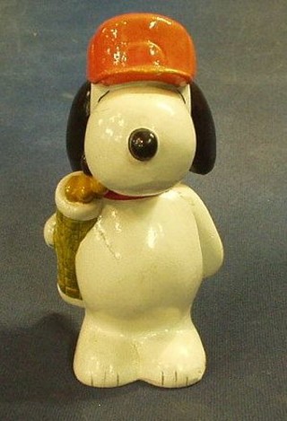 A pottery figure of a standing Snoopy golfer 6"