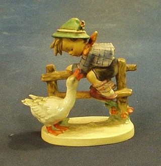 A Goebal figure of a boy climbing a fence with goose, the base marked 1948 195/1 (f and r)