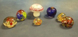 A collection of 7 paperweights