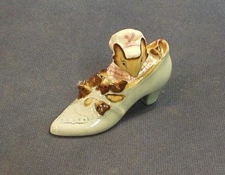 A Beatrix Potter figure "The Old Woman Who Lived in a Shoe"