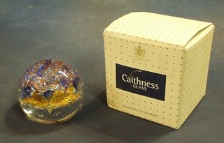 A Caithness paperweight, the base marked Caithness Wenturine 173/750, boxed