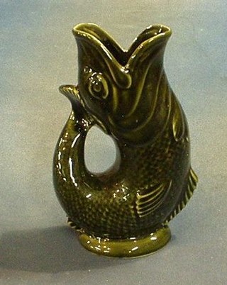 An Invento pottery gurgling fish jug 9" (slight chip to base)